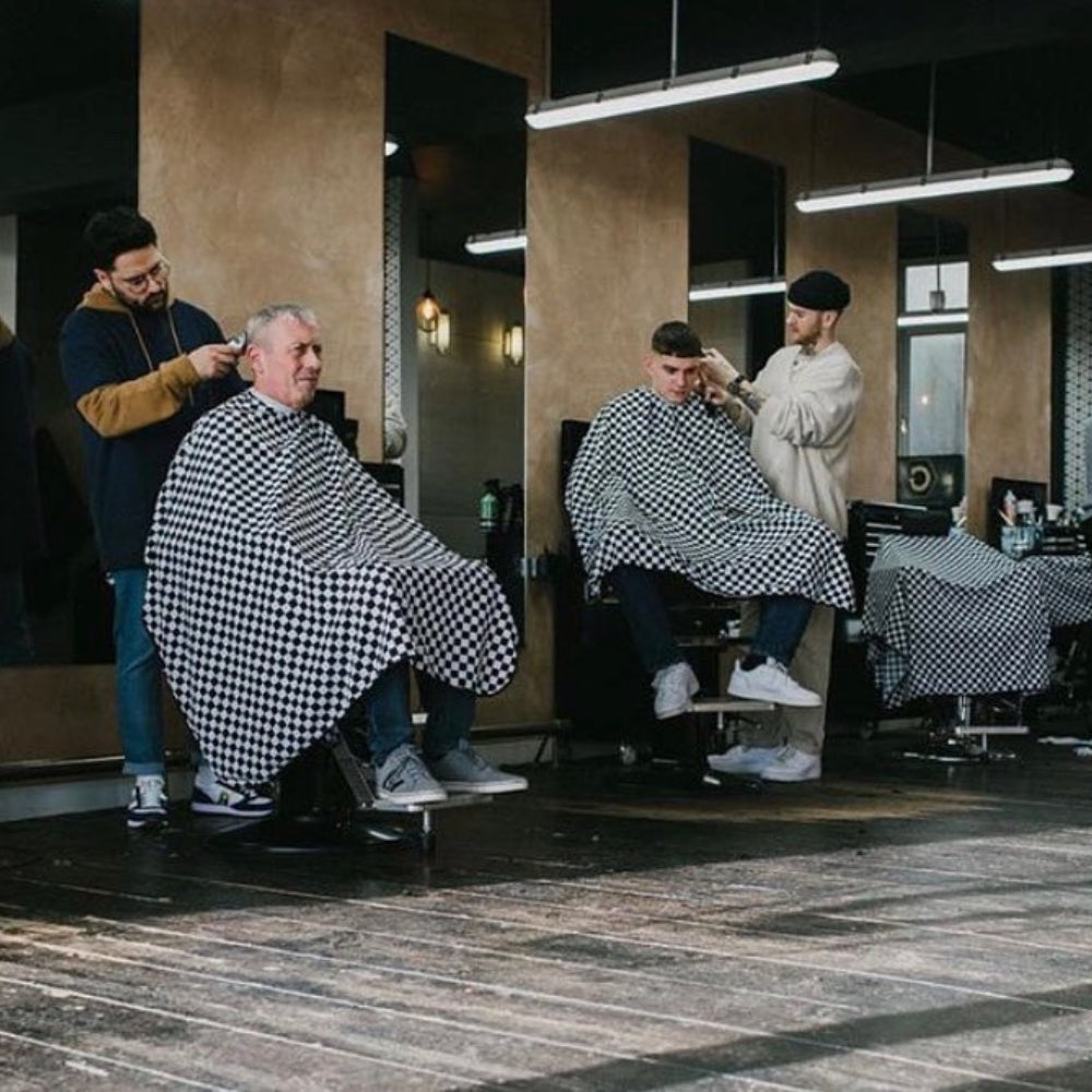 Cape de barbier "Houndstooth" col en lycra extensible et fermetures à boutons-pression (140cm/55" x 160cm/63") - Noir et blanc